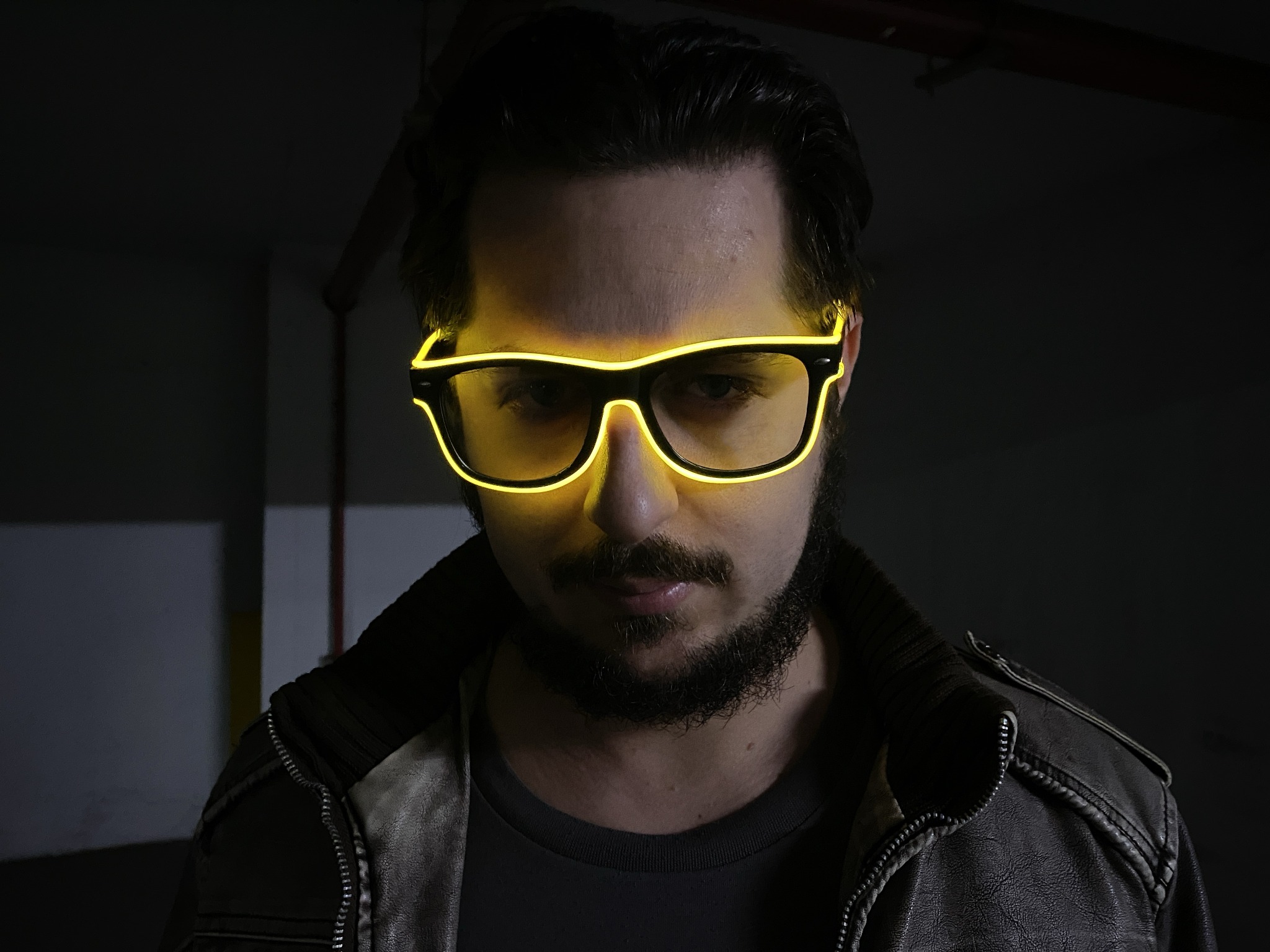 Portrait of Soul of Waves wearing illuminated yellow glasses